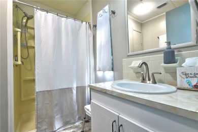 MOTIVATED SELLER! For sale in Barefoot Bay~ This 2 bed 2 bath on Barefoot Bay Golf Course in Florida - for sale on GolfHomes.com, golf home, golf lot