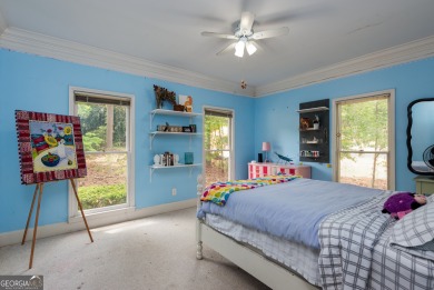 Perched on a slight slope overlooking the 11th fairway of the on Jennings Mill Country Club in Georgia - for sale on GolfHomes.com, golf home, golf lot