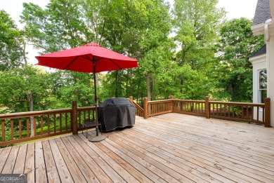 Perched on a slight slope overlooking the 11th fairway of the on Jennings Mill Country Club in Georgia - for sale on GolfHomes.com, golf home, golf lot