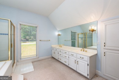 Perched on a slight slope overlooking the 11th fairway of the on Jennings Mill Country Club in Georgia - for sale on GolfHomes.com, golf home, golf lot