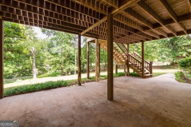 Perched on a slight slope overlooking the 11th fairway of the on Jennings Mill Country Club in Georgia - for sale on GolfHomes.com, golf home, golf lot