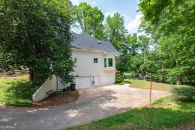 Perched on a slight slope overlooking the 11th fairway of the on Jennings Mill Country Club in Georgia - for sale on GolfHomes.com, golf home, golf lot