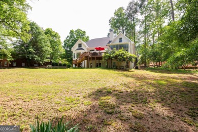 Perched on a slight slope overlooking the 11th fairway of the on Jennings Mill Country Club in Georgia - for sale on GolfHomes.com, golf home, golf lot