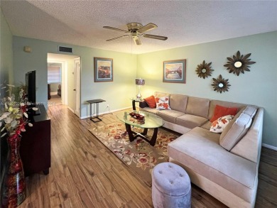 This charming end unit boasts an abundance of natural light and on Kings Point Golf -Flanders Way in Florida - for sale on GolfHomes.com, golf home, golf lot