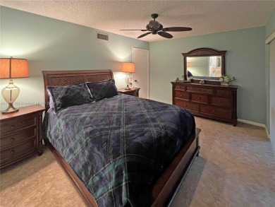 This charming end unit boasts an abundance of natural light and on Kings Point Golf -Flanders Way in Florida - for sale on GolfHomes.com, golf home, golf lot