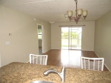 A golfer's dream! First floor, corner unit condo located on Hole on Deep Creek Golf Club in Florida - for sale on GolfHomes.com, golf home, golf lot