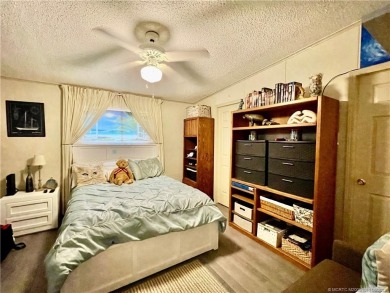 Lovely home with new wood laminate flooring throughout & extra on Indianwood Golf and Country Club in Florida - for sale on GolfHomes.com, golf home, golf lot