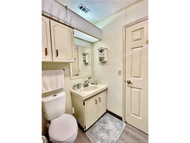 Lovely home with new wood laminate flooring throughout & extra on Indianwood Golf and Country Club in Florida - for sale on GolfHomes.com, golf home, golf lot