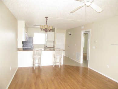 A golfer's dream! First floor, corner unit condo located on Hole on Deep Creek Golf Club in Florida - for sale on GolfHomes.com, golf home, golf lot