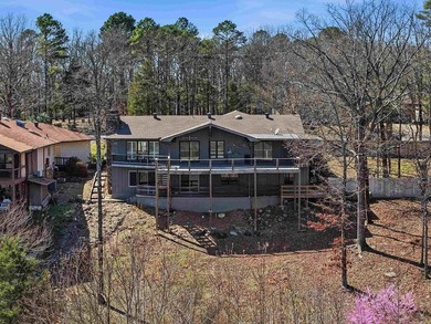 Discover exceptional lake & mountain views from this beautifully on Indian Hills Country Club in Arkansas - for sale on GolfHomes.com, golf home, golf lot