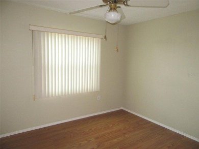 A golfer's dream! First floor, corner unit condo located on Hole on Deep Creek Golf Club in Florida - for sale on GolfHomes.com, golf home, golf lot