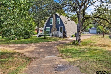 Nestled in the heart of Hideaway, Texas, this charming A-frame on Hide-A-Way Lake Golf Course in Texas - for sale on GolfHomes.com, golf home, golf lot