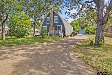 Nestled in the heart of Hideaway, Texas, this charming A-frame on Hide-A-Way Lake Golf Course in Texas - for sale on GolfHomes.com, golf home, golf lot