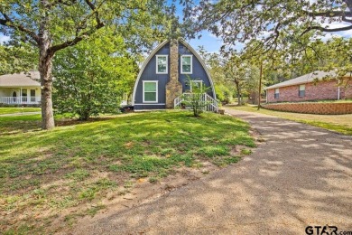 Nestled in the heart of Hideaway, Texas, this charming A-frame on Hide-A-Way Lake Golf Course in Texas - for sale on GolfHomes.com, golf home, golf lot