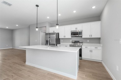 One or more photo(s) has been virtually staged. Walk to PINE on The Grand Club - Pine Lakes Course in Florida - for sale on GolfHomes.com, golf home, golf lot