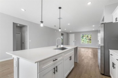 One or more photo(s) has been virtually staged. Walk to PINE on The Grand Club - Pine Lakes Course in Florida - for sale on GolfHomes.com, golf home, golf lot