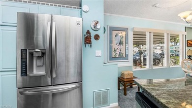 A golf cart is included, offering convenient access around the on The Rookery At Marco in Florida - for sale on GolfHomes.com, golf home, golf lot