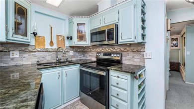 A golf cart is included, offering convenient access around the on The Rookery At Marco in Florida - for sale on GolfHomes.com, golf home, golf lot