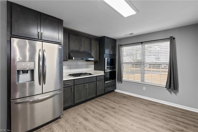 Spacious corner unit located in the Cypress Point Golf Club on Cypress Point Country Club in Virginia - for sale on GolfHomes.com, golf home, golf lot