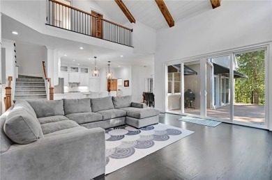 LAKEFRONT LIVING with over 180' of Lake Kedron views and on Canongate At Flat Creek Club in Georgia - for sale on GolfHomes.com, golf home, golf lot