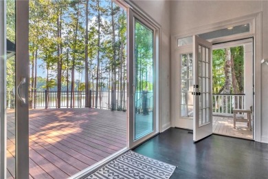 LAKEFRONT LIVING with over 180' of Lake Kedron views and on Canongate At Flat Creek Club in Georgia - for sale on GolfHomes.com, golf home, golf lot