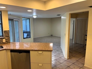 A solid two-story 4 bed/ 2.5 bath, 2 car garage, pool home is on Northdale Golf and Tennis Club in Florida - for sale on GolfHomes.com, golf home, golf lot