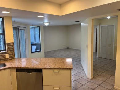 A solid two-story 4 bed/ 2.5 bath, 2 car garage, pool home is on Northdale Golf and Tennis Club in Florida - for sale on GolfHomes.com, golf home, golf lot