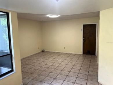 A solid two-story 4 bed/ 2.5 bath, 2 car garage, pool home is on Northdale Golf and Tennis Club in Florida - for sale on GolfHomes.com, golf home, golf lot