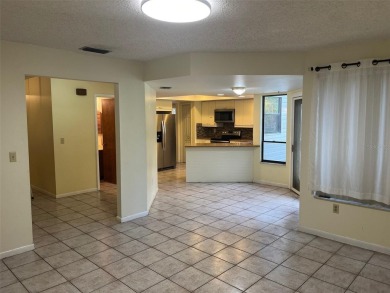 A solid two-story 4 bed/ 2.5 bath, 2 car garage, pool home is on Northdale Golf and Tennis Club in Florida - for sale on GolfHomes.com, golf home, golf lot