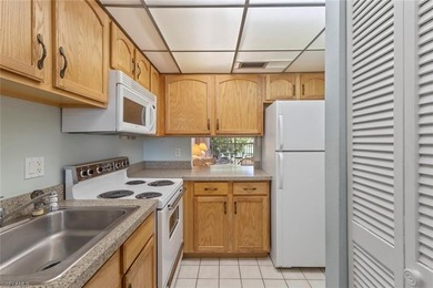 This METICULOUSLY MAINTAINED two bedroom, two bath condominium on San Carlos Golf Club in Florida - for sale on GolfHomes.com, golf home, golf lot