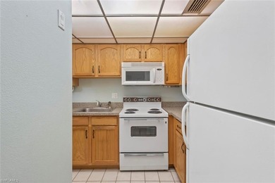 This METICULOUSLY MAINTAINED two bedroom, two bath condominium on San Carlos Golf Club in Florida - for sale on GolfHomes.com, golf home, golf lot