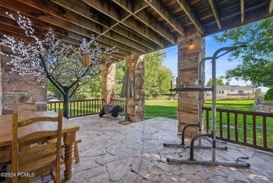 Embrace the vibrant beauty of spring and summer in this on Homestead Golf Club and Resort in Utah - for sale on GolfHomes.com, golf home, golf lot