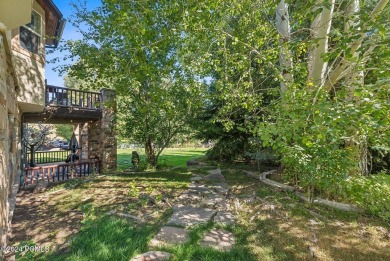 Embrace the vibrant beauty of spring and summer in this on Homestead Golf Club and Resort in Utah - for sale on GolfHomes.com, golf home, golf lot