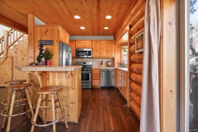 Discover the ultimate mountain getaway in this gorgeous full-log on Big Bear Mountain Ski and Golf Resort in California - for sale on GolfHomes.com, golf home, golf lot