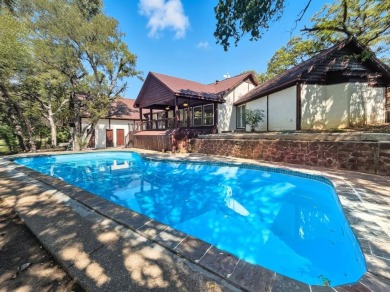 Stunning, updated multi-level home with pool on the East side of on Woodhaven Country Club in Texas - for sale on GolfHomes.com, golf home, golf lot