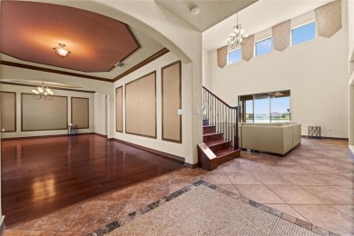 Welcome to this WATERFRONT GEM with 6 bedrooms and 4 full on Oaks National Golf Course in Florida - for sale on GolfHomes.com, golf home, golf lot