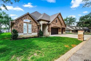 Step into the grand entrance of this exquisite lakehouse and be on Emerald Bay Club in Texas - for sale on GolfHomes.com, golf home, golf lot