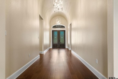 Step into the grand entrance of this exquisite lakehouse and be on Emerald Bay Club in Texas - for sale on GolfHomes.com, golf home, golf lot