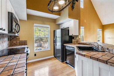 This stunning 3-bedroom, 2-bathroom home (with a loft serving as on Westchase Golf Club in Florida - for sale on GolfHomes.com, golf home, golf lot