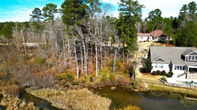 This gently sloping .48 acre waterfront lot offers an expansive on The Reserve Club At Woodside Plantation in South Carolina - for sale on GolfHomes.com, golf home, golf lot
