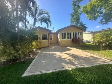 Lot Rent $1342.00 Monthly  Total square footage under A/C is on Del Tura Golf and Country Club in Florida - for sale on GolfHomes.com, golf home, golf lot