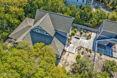 Exuding curb appeal, this four-bedroom, 3.5-bath 2017-built home on Bald Head Island Golf Club in North Carolina - for sale on GolfHomes.com, golf home, golf lot