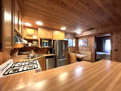 Welcome to your dream mountain escape! This stunning three-level on Lake Almanor West Golf Course in California - for sale on GolfHomes.com, golf home, golf lot