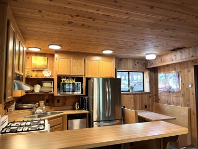Welcome to your dream mountain escape! This stunning three-level on Lake Almanor West Golf Course in California - for sale on GolfHomes.com, golf home, golf lot