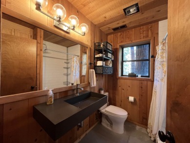 Welcome to your dream mountain escape! This stunning three-level on Lake Almanor West Golf Course in California - for sale on GolfHomes.com, golf home, golf lot