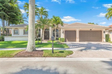 Luxury living awaits in this stunning one-story pool home on the on Weston Hills Country Club in Florida - for sale on GolfHomes.com, golf home, golf lot