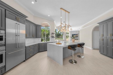 Luxury living awaits in this stunning one-story pool home on the on Weston Hills Country Club in Florida - for sale on GolfHomes.com, golf home, golf lot