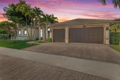 Luxury living awaits in this stunning one-story pool home on the on Weston Hills Country Club in Florida - for sale on GolfHomes.com, golf home, golf lot