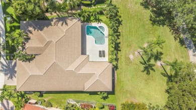 Luxury living awaits in this stunning one-story pool home on the on Weston Hills Country Club in Florida - for sale on GolfHomes.com, golf home, golf lot