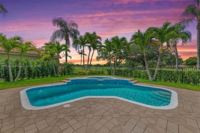 Luxury living awaits in this stunning one-story pool home on the on Weston Hills Country Club in Florida - for sale on GolfHomes.com, golf home, golf lot
